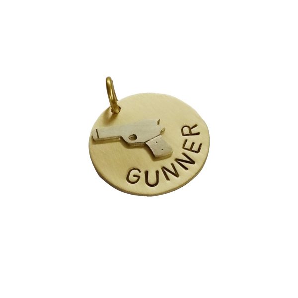 Hand made dog tag with a Gun